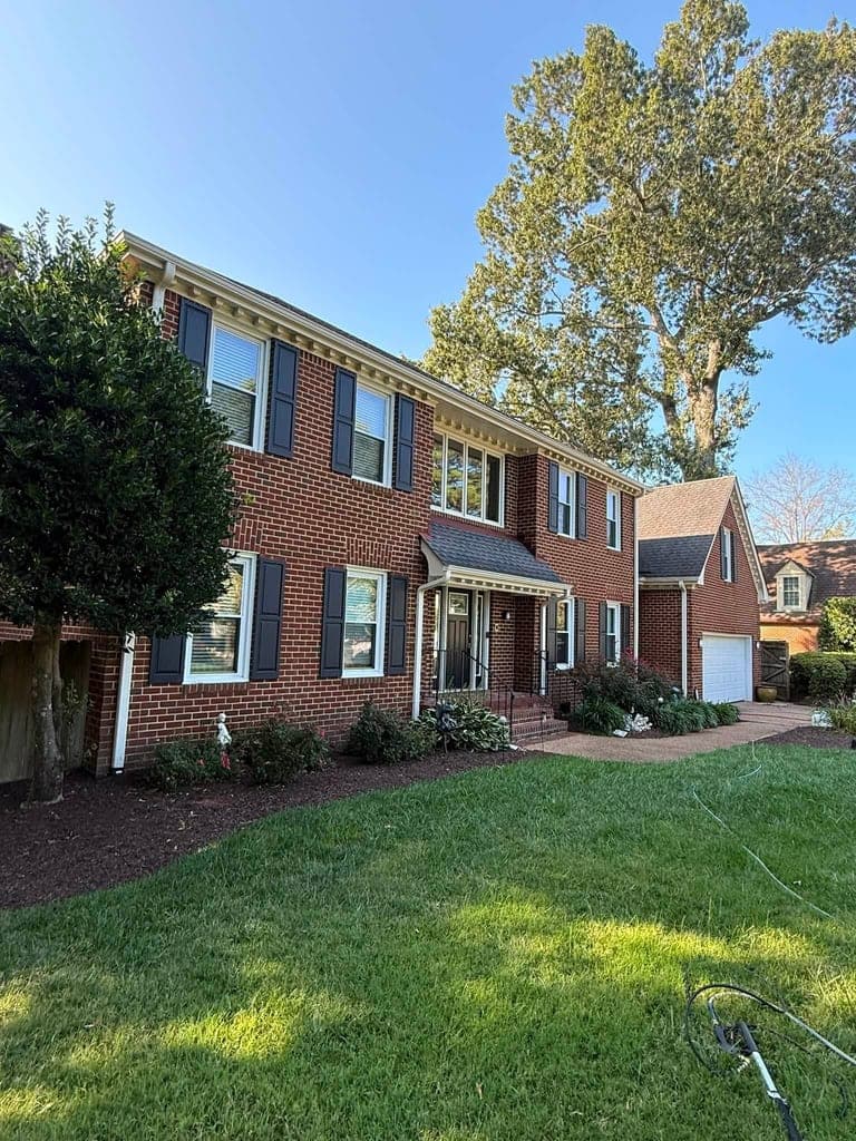 Clean brick house exterior in the evening after pressure washing